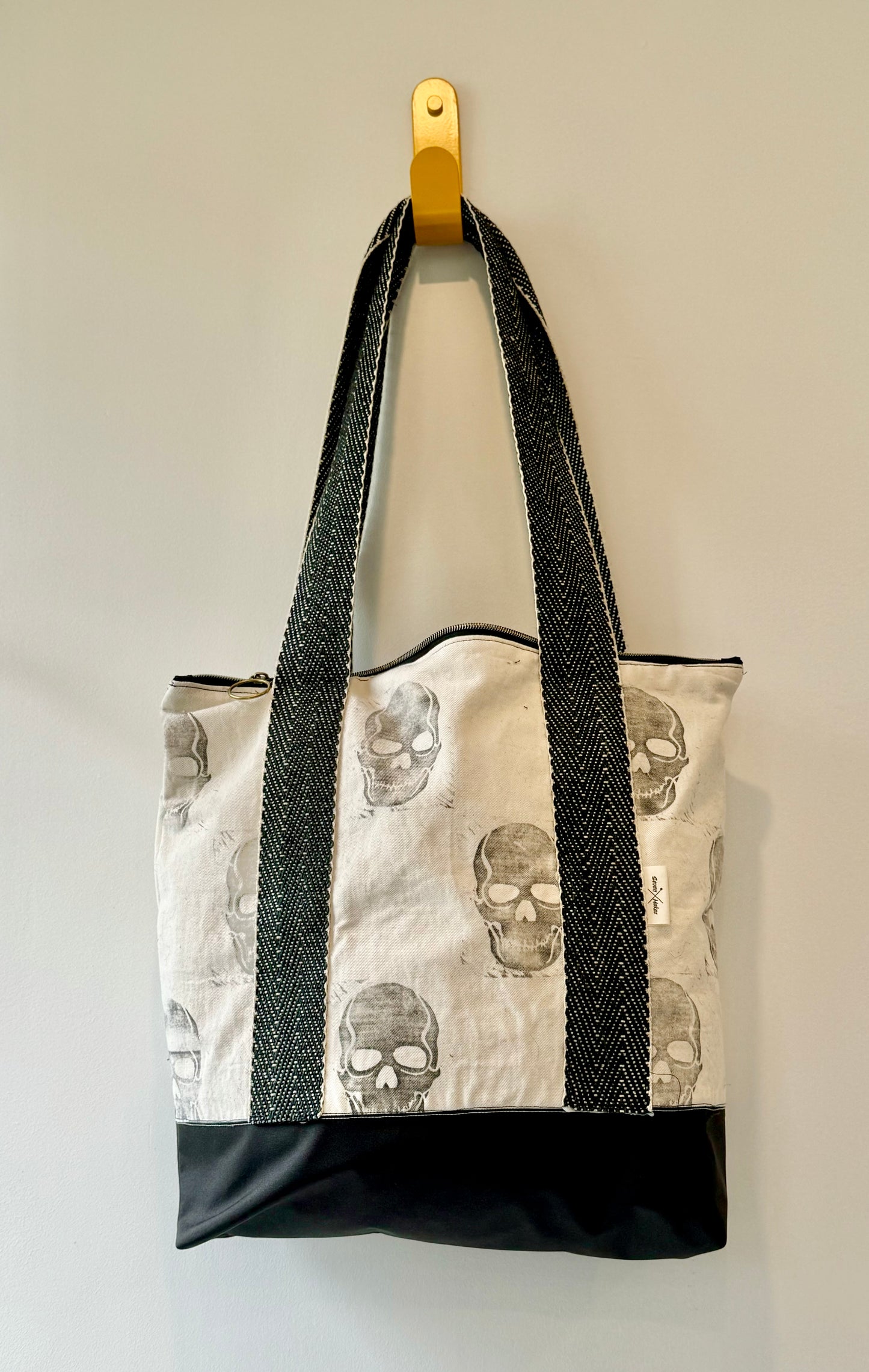 hand printed with skulls, this waterproof based shoulder bag is lined and includes a zip and inner pocket - a really unique gift idea