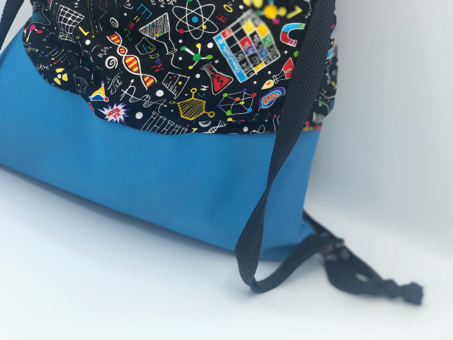 Backpack style bag - cool science fabric with waterproof bottom